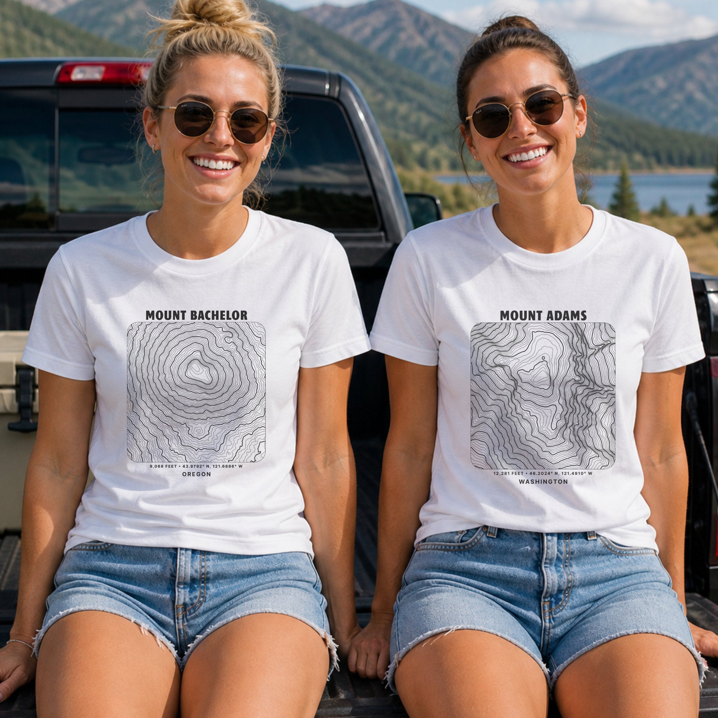 Two women sitting outdoors wearing white graphic t-shirts